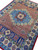 Perspective shot of the 9x13 Mamlook wool rug showing full medallion and border layout