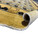 Rolled edge showing ivory cotton fringe, plush wool pile and the honey gold border