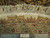 Back of rug beside a ruler showing tight hand-knotted weave and authentic hand knotted tag