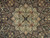 Close-up of ivory and light blue star medallion with tiny blossoms and diamond cartouches