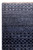 Close-up corner showing ivory fringe, navy pile and fine diamond lattice knotting in soft wool