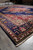 10'3 x 12'7 Persian rug corner with ivory fringe photographed inside the Freeport warehouse