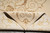 Folded corner revealing the even back and tight hand-knotted weave of the wool silk rug