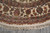 Curved border detail with floral guard stripes, palmette cresting and knotted ivory fringe collar