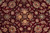 All over floral repeat of rosettes, palmettes and leaf vines on ruby red ground