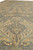 Large beige palmettes and leafy vines spread across the gray wool field in antique tones