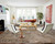 Khaki 8x11 Persian Heriz rug anchoring a white living room with Barcelona chairs
