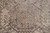 Central stepped medallion close-up with taupe rosettes, hooked diamonds and softly faded khaki tones