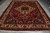 9 x 12 Bakhtiar Persian rug photographed flat on grey tile with cream fringe visible