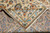 Folded corner showing tight hand-knotted back, cotton foundation and ivory fringe of the Kashan rug