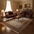 Traditional living room styled with ivory and coral Persian rug under dark wood coffee table