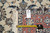 Back tag reading rug number PIX-23710 with tape measure across the hand-knotted foundation