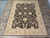 8' x 11' Pakistani Chobi rug from above, dark brown floral field and wide beige border