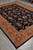 Living room sized 9'3" x 11'8" Zigler Chobi rug displayed at an angle on grey tile