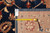 Back tag and tape measure confirming the 9'3" x 11'8" hand-woven Oriental rug dimensions