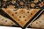 Folded corner revealing dense hand-knotted back and tight weave of this new Pakistani wool rug