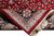 Folded corner revealing tight knotting on the back of this wool and silk Kashan design rug