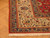 Ivory main border with blue guard stripes and cotton fringe at corner of Persian rug
