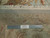 Back of the rug with ruler showing knot density, cotton foundation and hand-tied ivory fringe