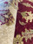 Indian hand-knotted rug macro showing ivory border wool, burgundy field and crisp knot definition