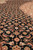 Macro of the fish pattern lattice, showing dense knotting and silk sheen in the pile