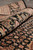Rolled edge of the 8x10 wool and silk rug showing pile depth and floral border