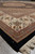 Low angle across the black Tabriz Mahi design rug toward ivory border and fringe