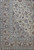 Corner detail showing multiple guard borders, palmettes and scrolling vines on the ivory Kashan field