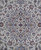 Close-up of the layered navy and taupe medallion surrounded by red rosettes and blue vinework