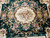 Center field close-up: green ground, gold acanthus scrolls and ivory floral medallion