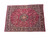 Angled studio shot showing ivory guard borders, navy main border and dense all-over floral field