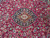 Central medallion framed by mirrored palmettes on the 9'7" x 13'5" hand-knotted wool rug