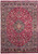 Full view of 9'7" x 13'5" Persian Mashad rug with navy medallion on burgundy field