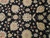 Close-up of vegetable dyed wool pile with coral rosettes, gold palmettes and scrolling vines