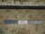 Back of the rug with ruler measuring knot count, cotton foundation and Authentic Handmade label