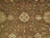 Close-up of brown field showing ivory quatrefoil ornament, palmettes, rose blossoms and curling vines
