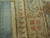Ruler against the weave showing knots per square inch on this hand-knotted Indian wool rug