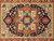 Close-up of 8 point coral and sage medallion with cream cartouches on navy field