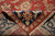Folded corner showing tight back weave, cotton fringe and dense wool pile of the rug