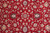 Symmetrical field detail with navy blossom motifs, grey blue rosettes and serrated curling leaves