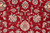 9'1" x 12'2" wool rug close-up showing pink and cream palmettes on burgundy ground