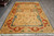 6'2" x 9'7" Ziegler Chobi area rug photographed lengthwise with ivory fringe and floral field