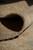 9'1" x 11'7" hand-knotted rug rolled back to show dense foundation and wool pile