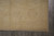 Close view of camel guard border and hand-tied ivory fringe along one rug end