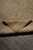 Folded corner reveals ivory border, teal field and short quarter inch natural wool pile
