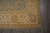 Border corner of the Chobi wool rug with shield cartouches and scrolling floral vines