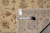 Reverse side with genuine hand woven Oriental rug tag F-4097 and tape measure for scale
