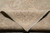 Folded edge revealing dense hand-knotted wool pile and tight cotton foundation of the rug