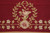 Laurel wreath and pink rose motif woven on deep burgundy ground beside flowering vine