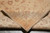Folded corner showing the back of the rug, knot density and crisp pattern definition